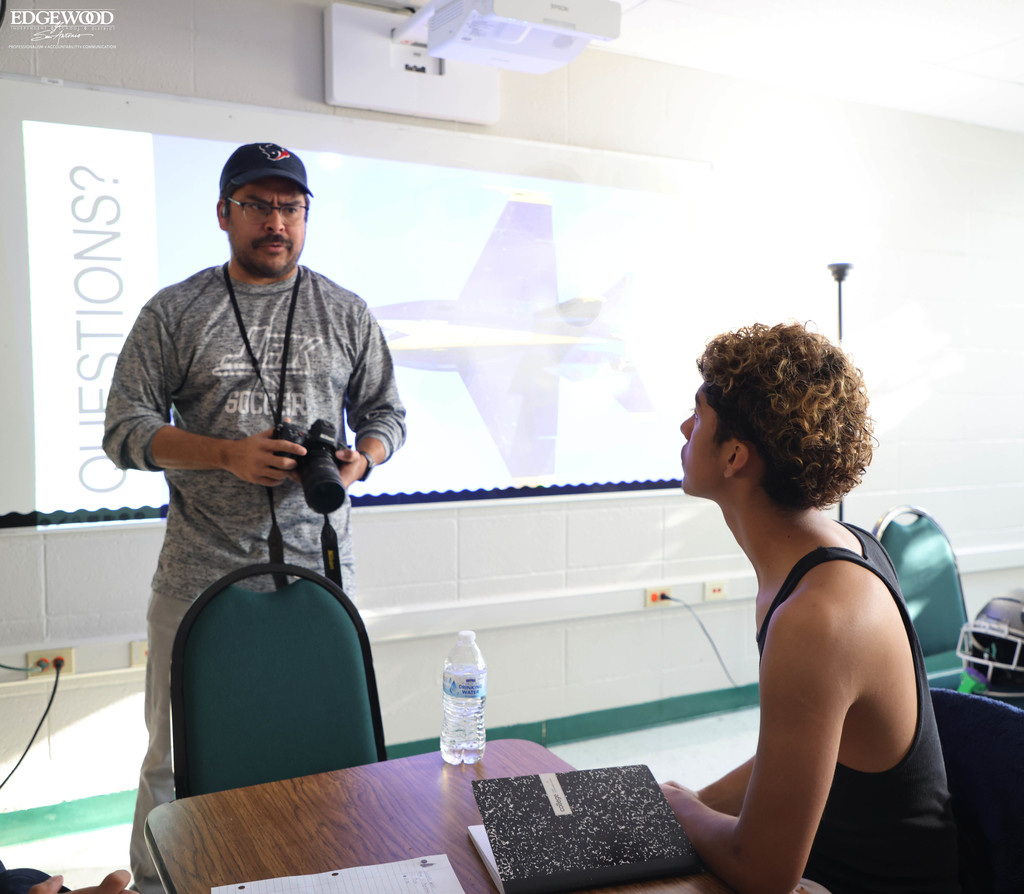 JFK journalism student listens to lecture on framing photos
