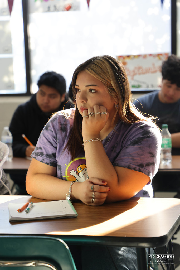 JFK journalism student listens to lecture on framing photos