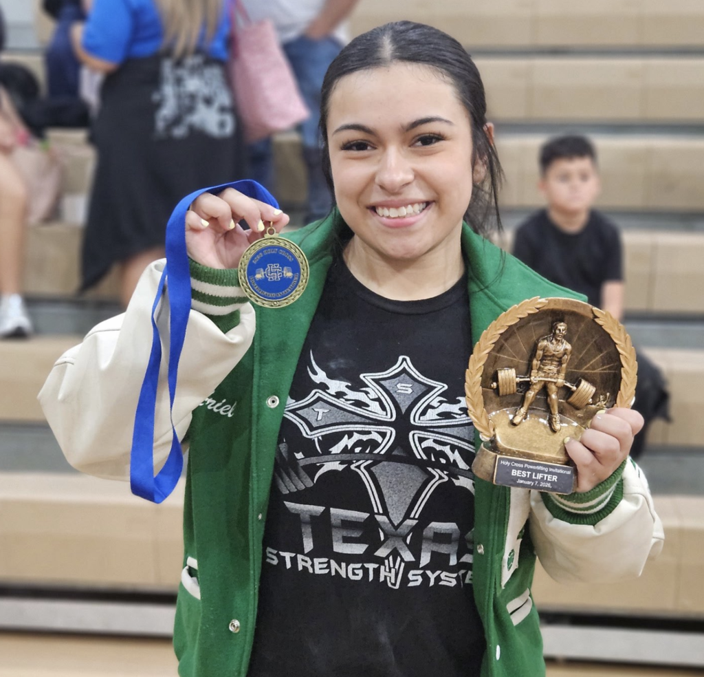 JFK powerlifter Ariel C. shows a first place medal and "best lifter" award