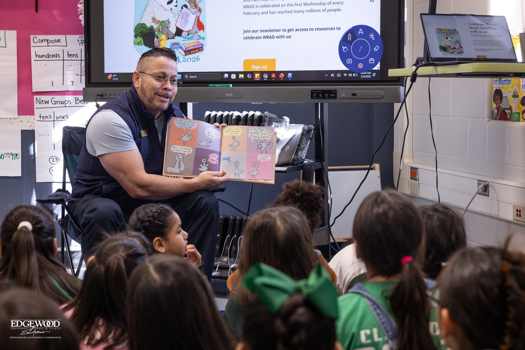 Coach Benavides reads to students at LPLSG