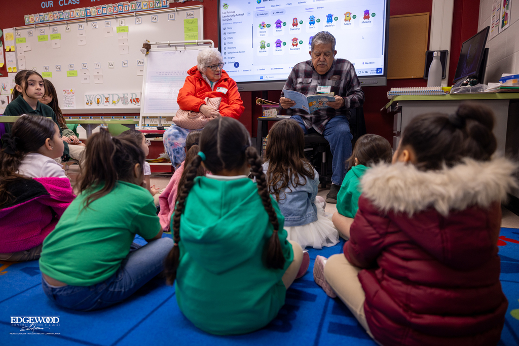Parent volunteers read to students at LPLSG
