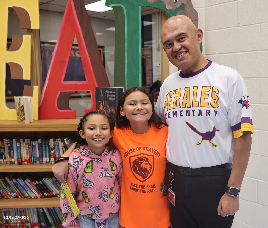 Superintendent Dr. Hernandez with two Perales students