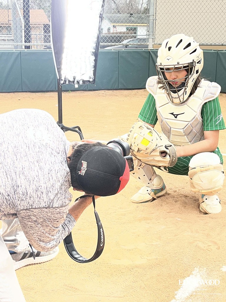 behind the scenes photo of a Kennedy softball player