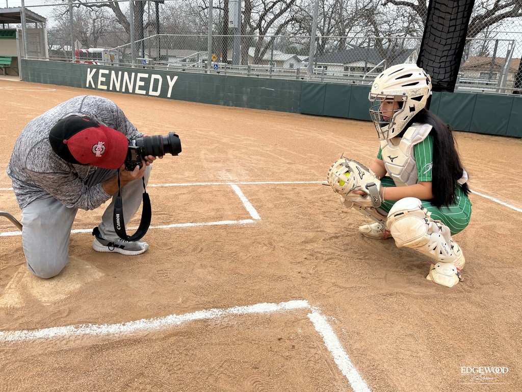behind the scenes photo of a Kennedy softball player