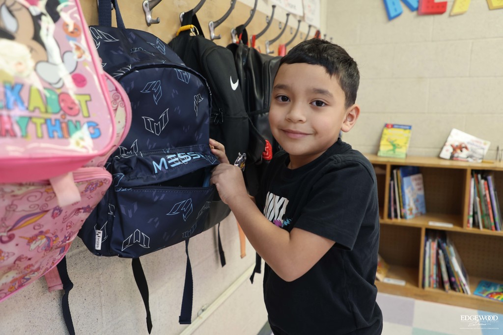 LBJ Student hangs his backpack