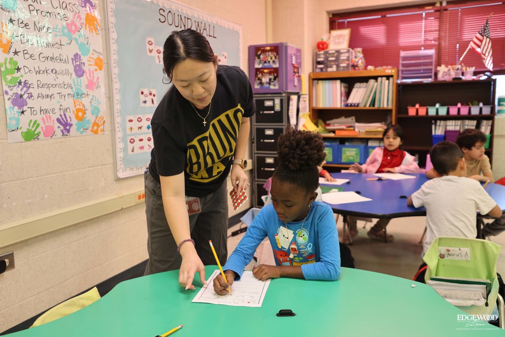 Ms. Kim at LBJ helps a student