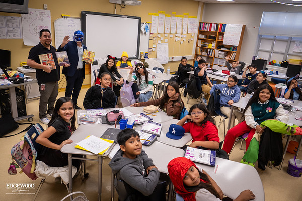 Teachers and children engaged in reading