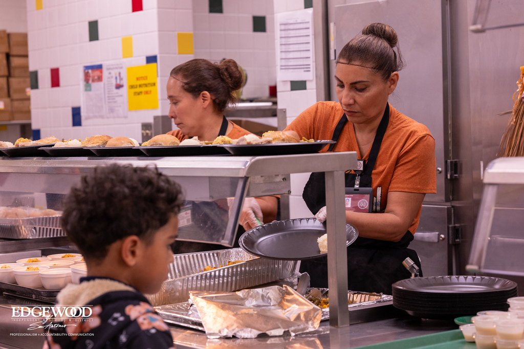 Kitchen staff serving nutritional lunch
