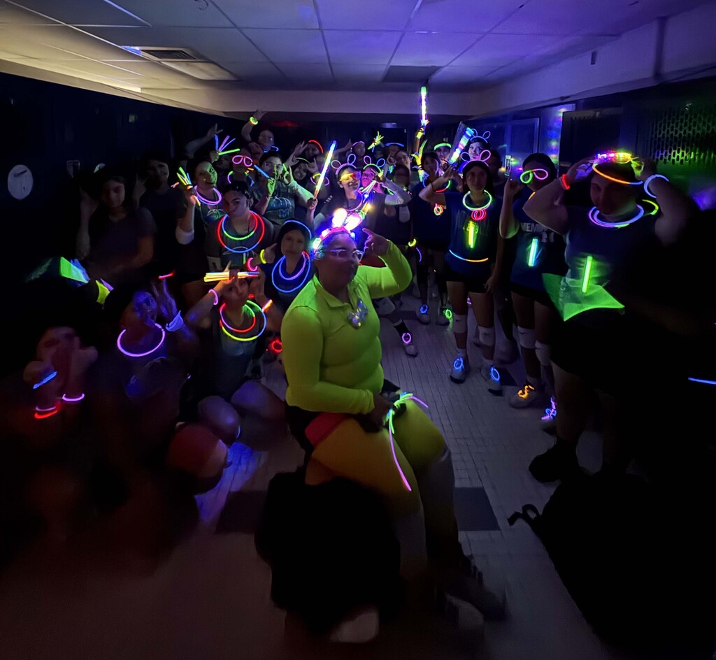 MHS volleyball team building with neon lights