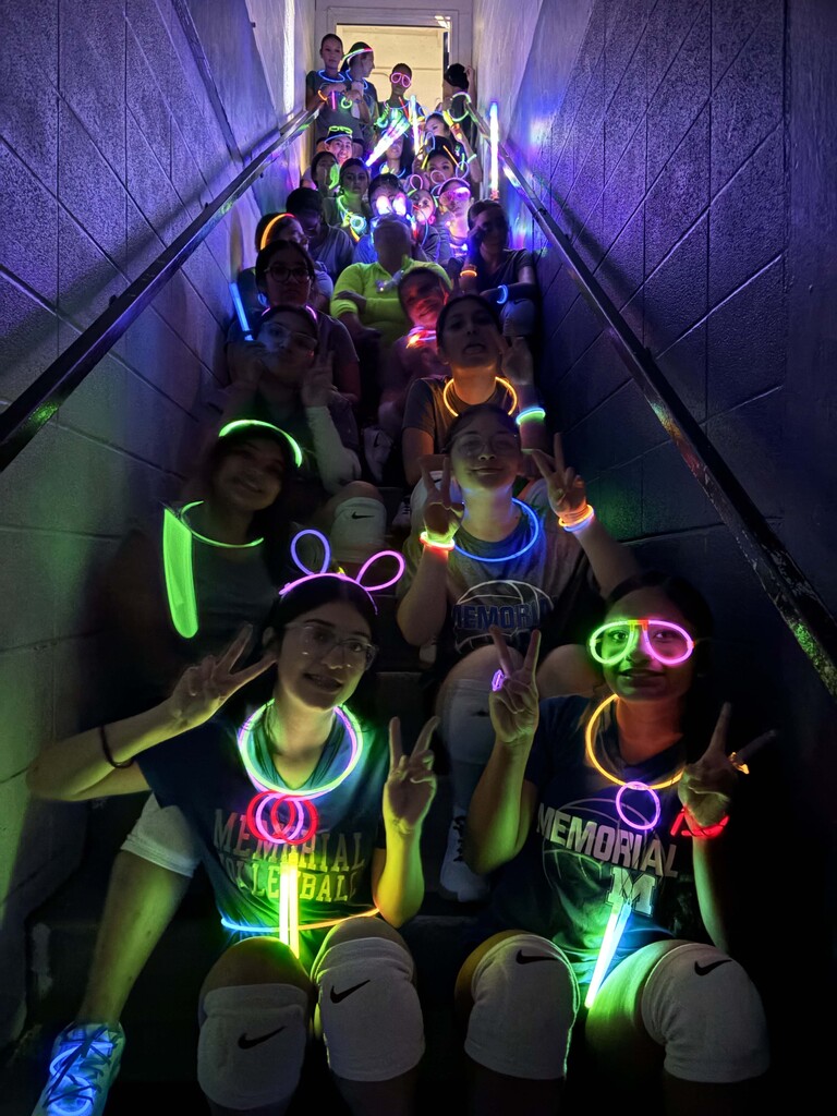 MHS volleyball team building with neon lights