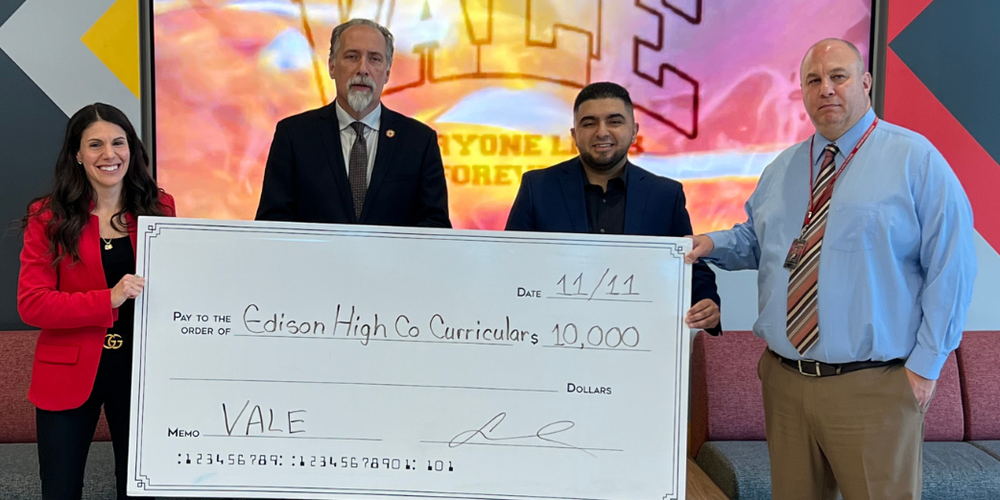 EHS receives grant from student that graduated in 2018. Big check, $10,000, four people