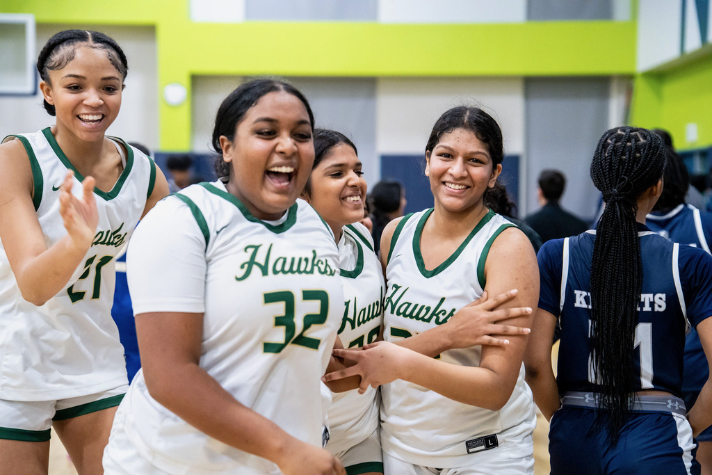 Girls basketball celebrating win