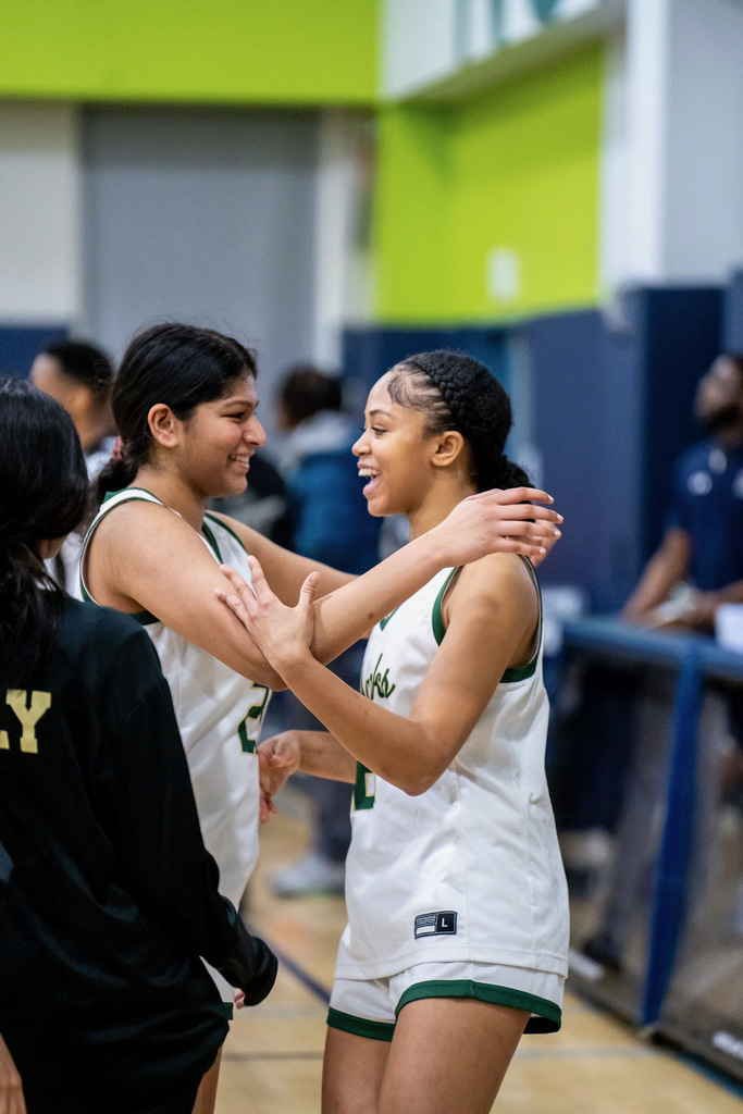 Girls basketball celebrating win