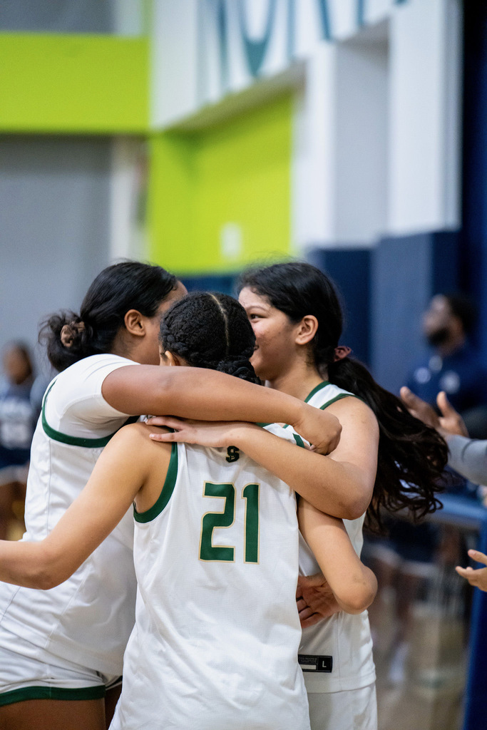 Girls basketball celebrating win