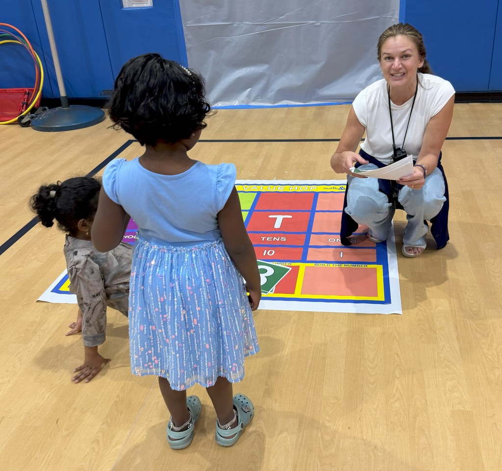Teacher with child on rug