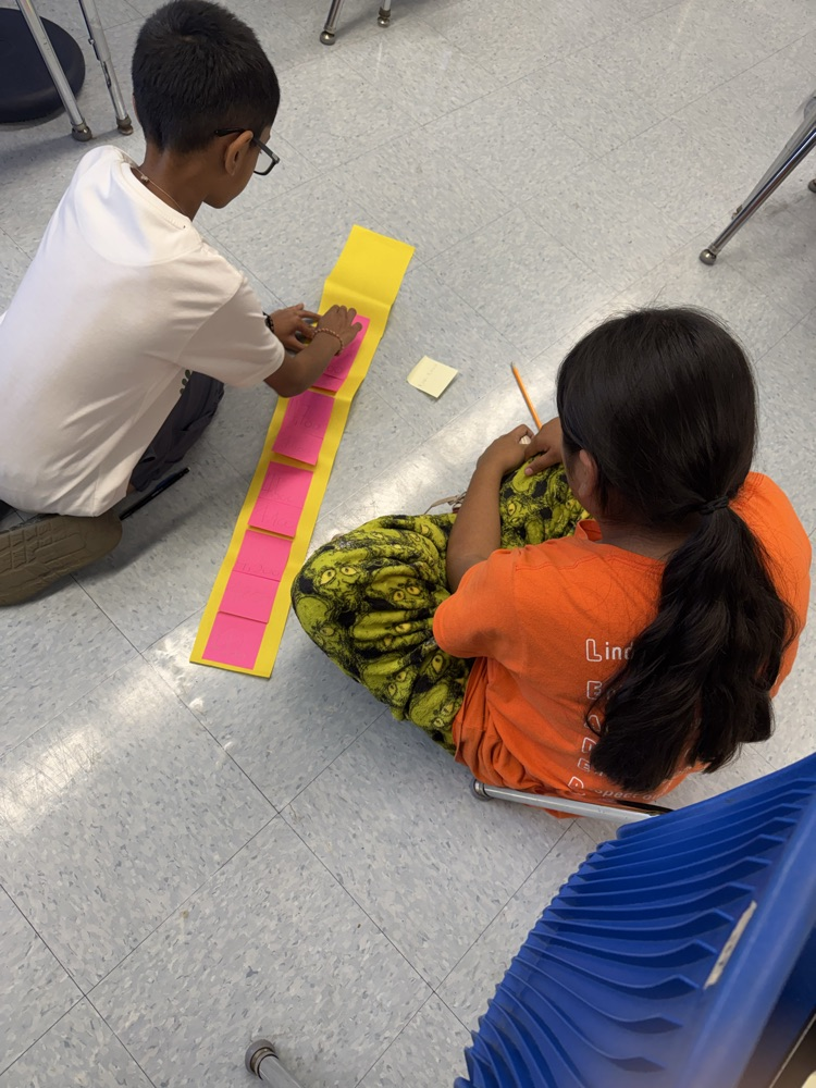 students working together to create 10,000