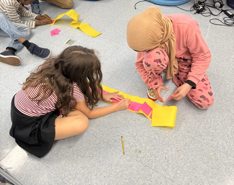 students working together to create 10,000