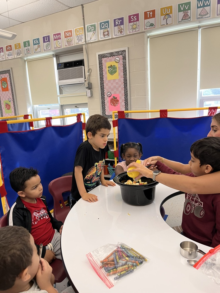 students making applesauce