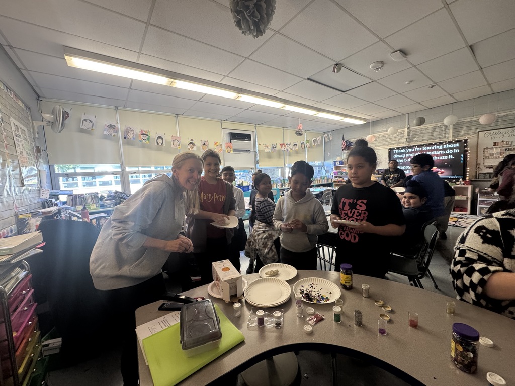 Students making diyas