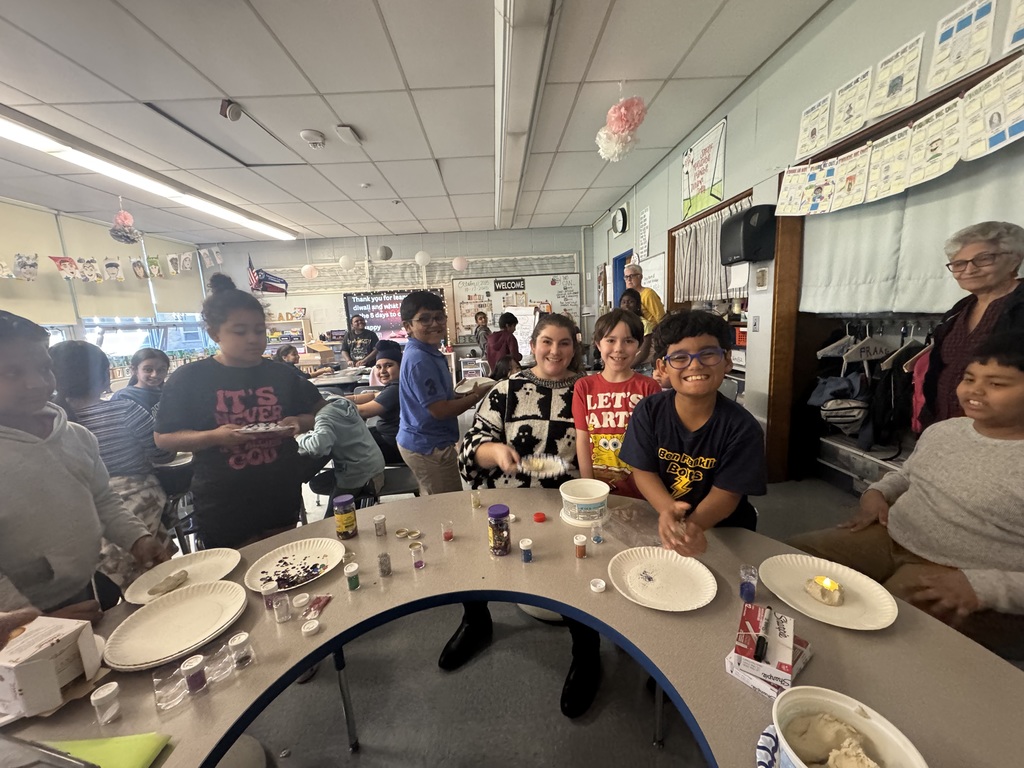 Students making diyas