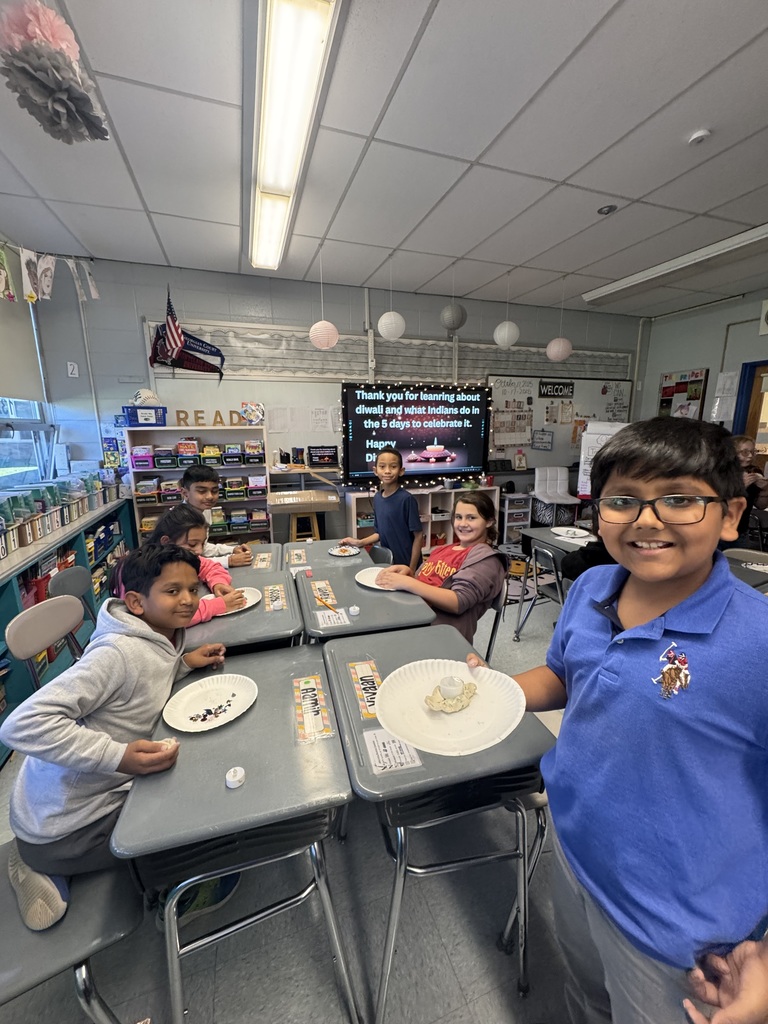 Students making diyas