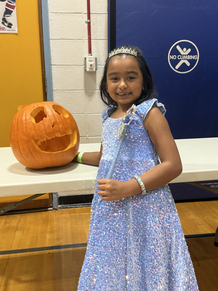child with pumpkin