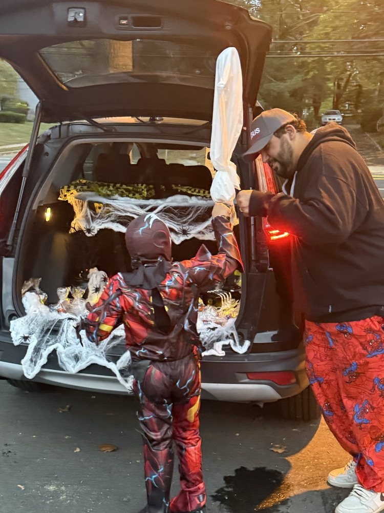 handing out candy while children trick or treat