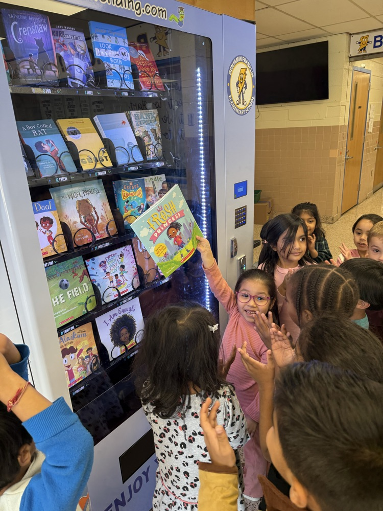 students choosing books from the vending machine