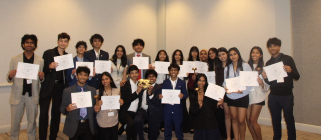 Model UN students holding awards