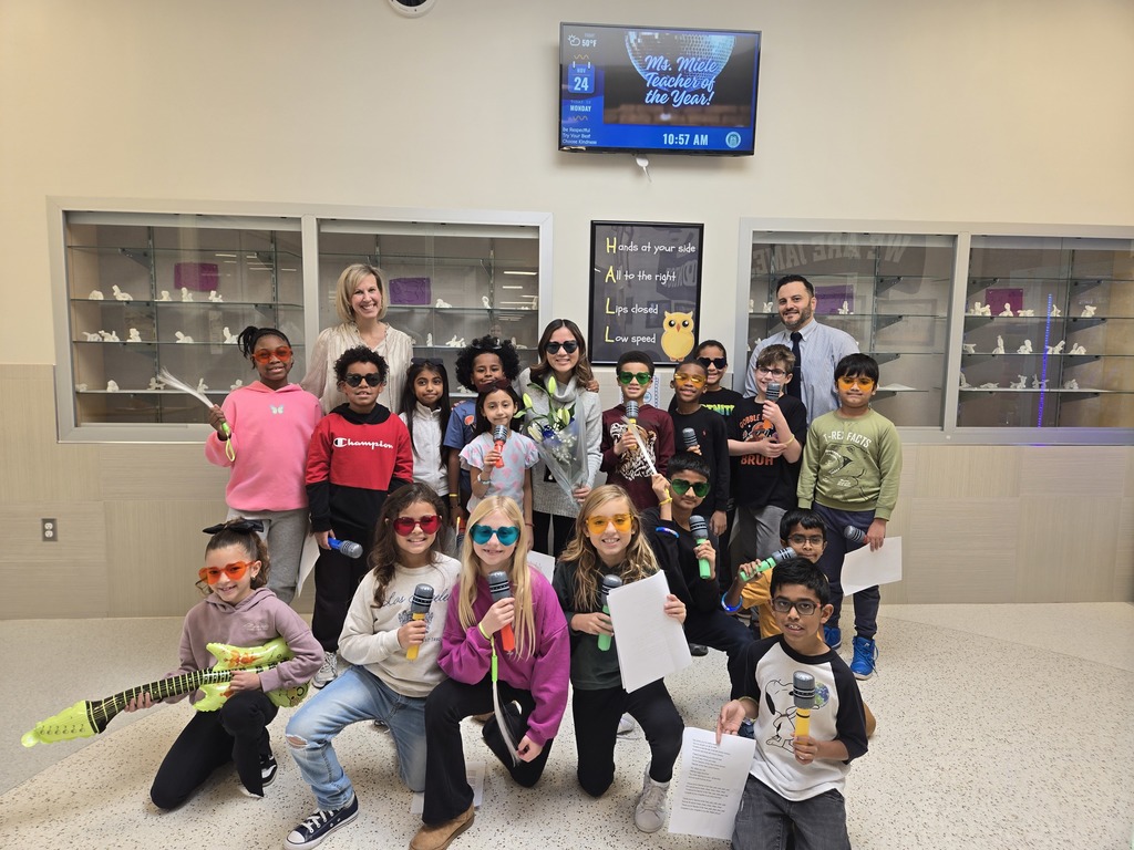 This picture includes Miss Miele's class along with Mrs. Tufaro and Mr. H as she is appointed Teach of the Year for the 2025-2026 schoolyear. 