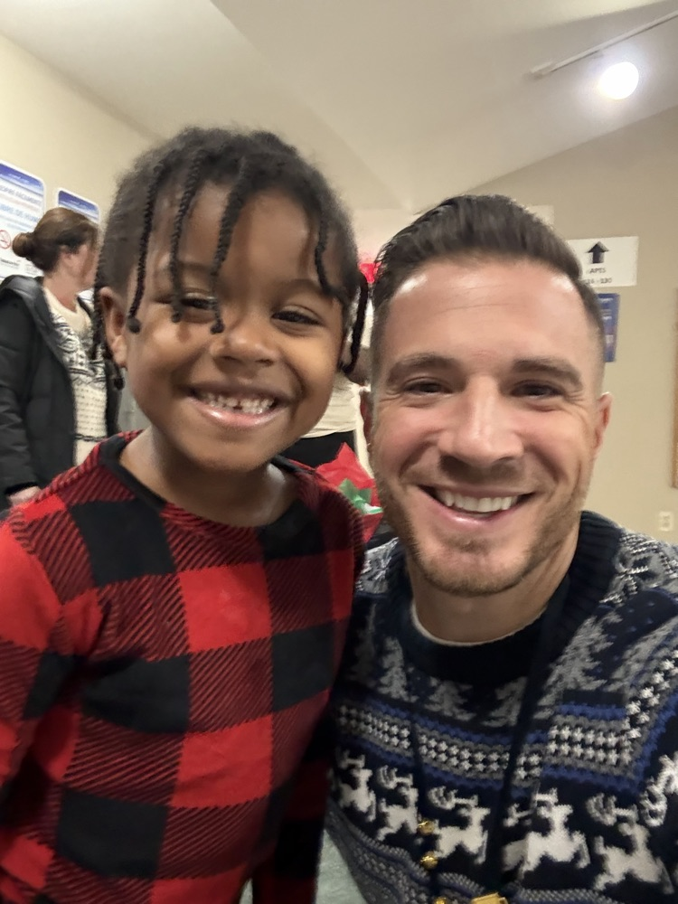  Santa, Jingles and Benny delivering presents with Dr. Bevere and Mr. D