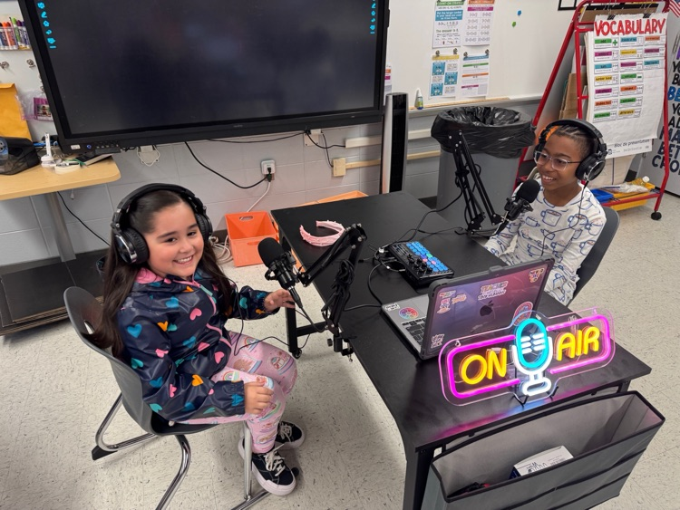 students recording themselves using new equipment 