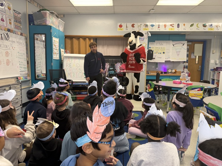 chick fil a’s cow reading to 2nd grade