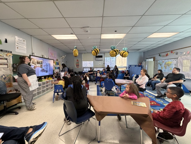 teachers reading book to students