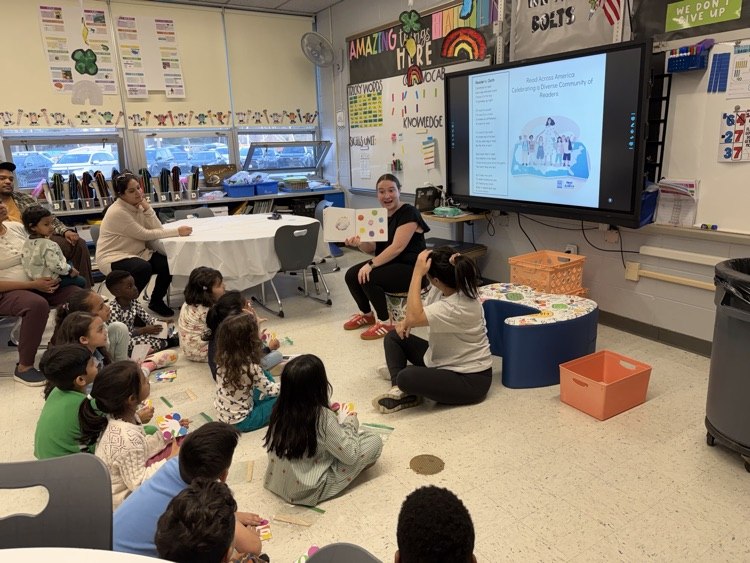 teachers reading book to students