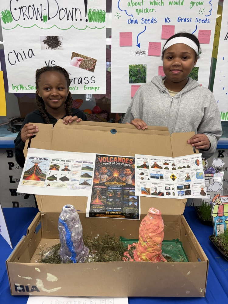 students displaying their science project