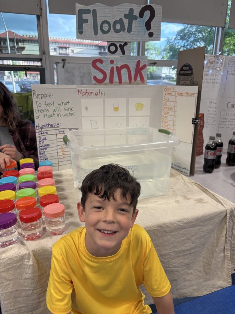 student displaying their science project