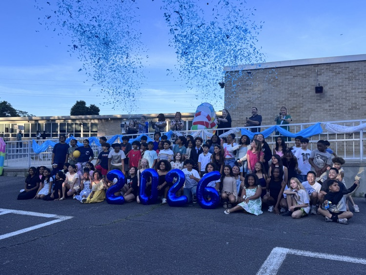 fifth graders and their families enjoying the social