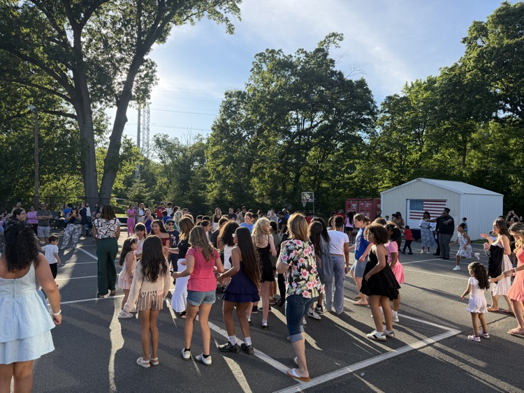 fifth graders and their families enjoying the social