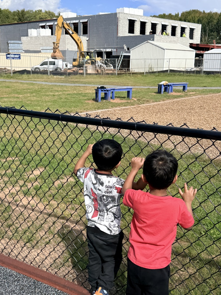 Students watching construction machinery