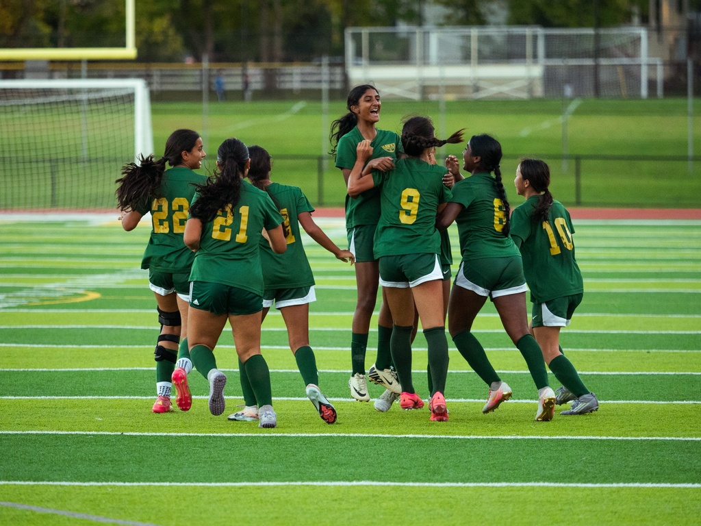 JPS Girls Soccer celebrating a goal.