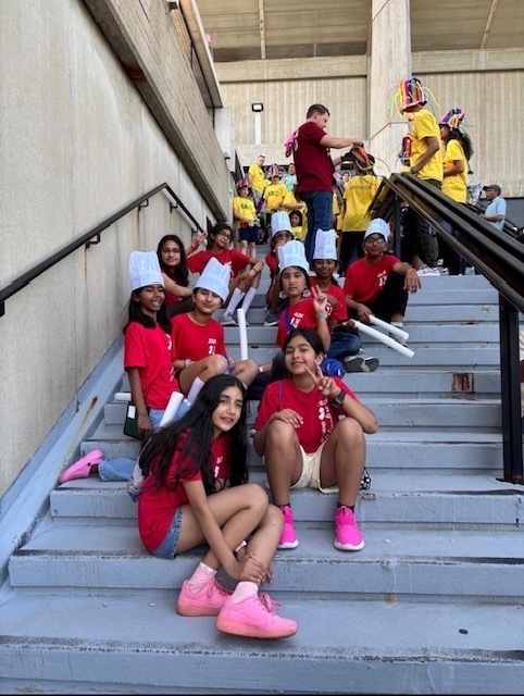 SOM Photos- Students at competition wearing red OM shirts