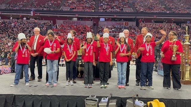 SOM Photos- Students at competition wearing red OM shirts