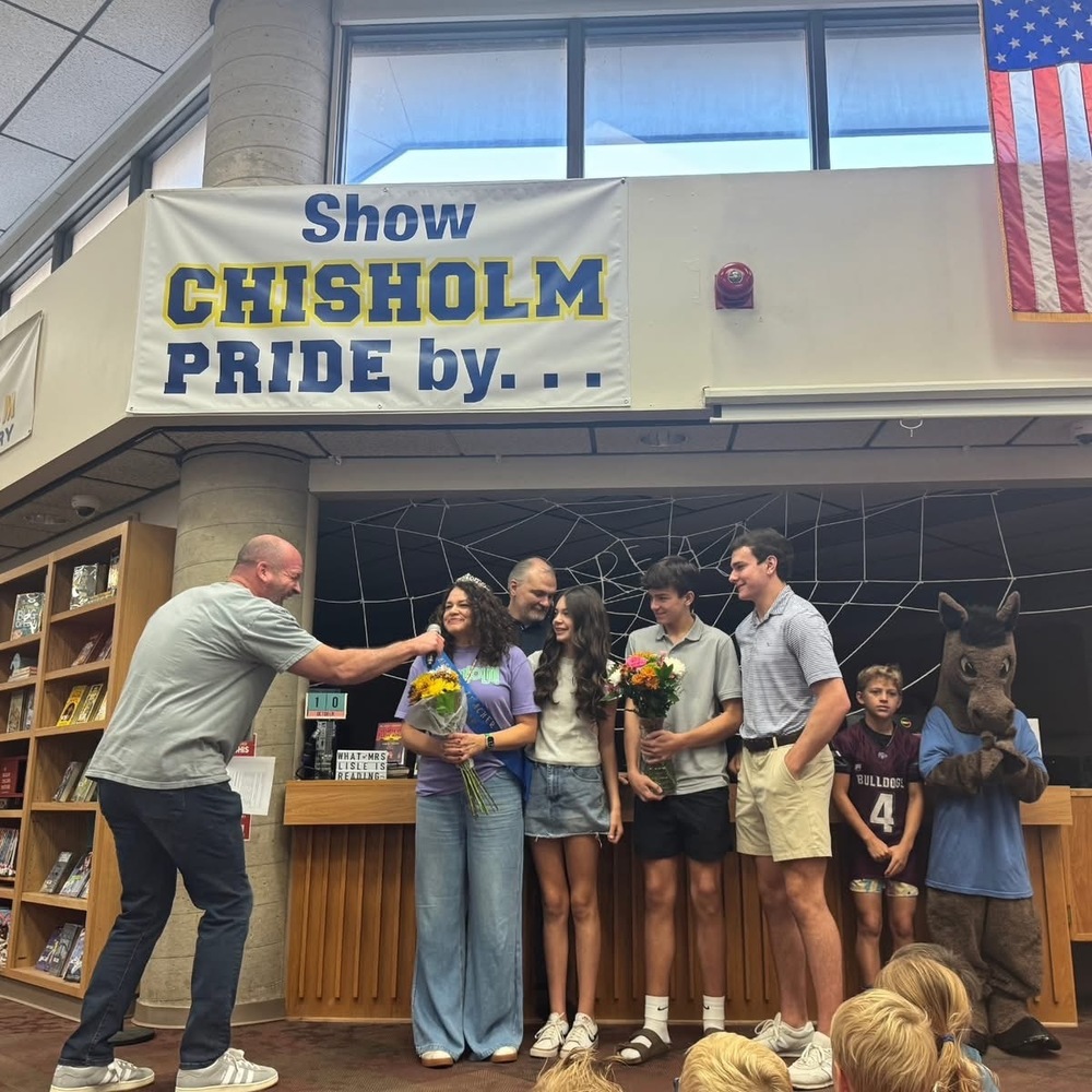 Teacher of the Year with administrator and family at Charge Up