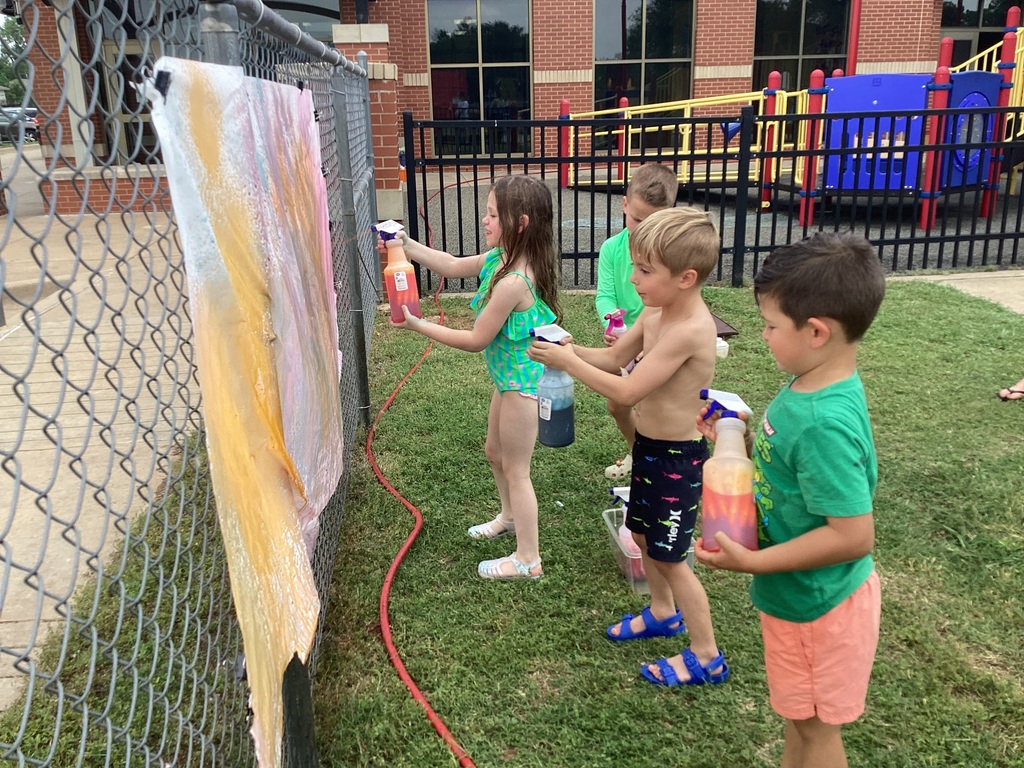 Children creating water color art