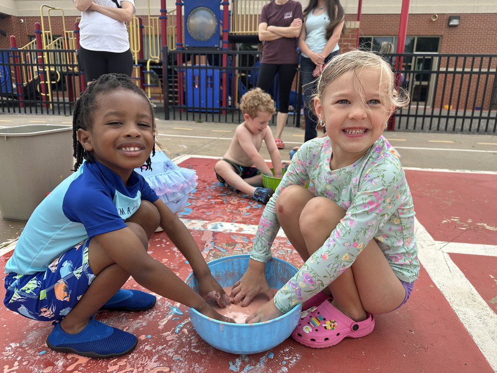 Two students playing in goop