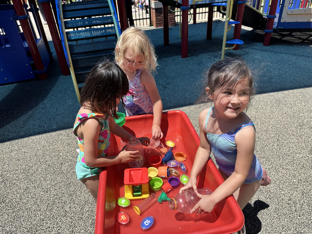 Students playing in a sensory tub