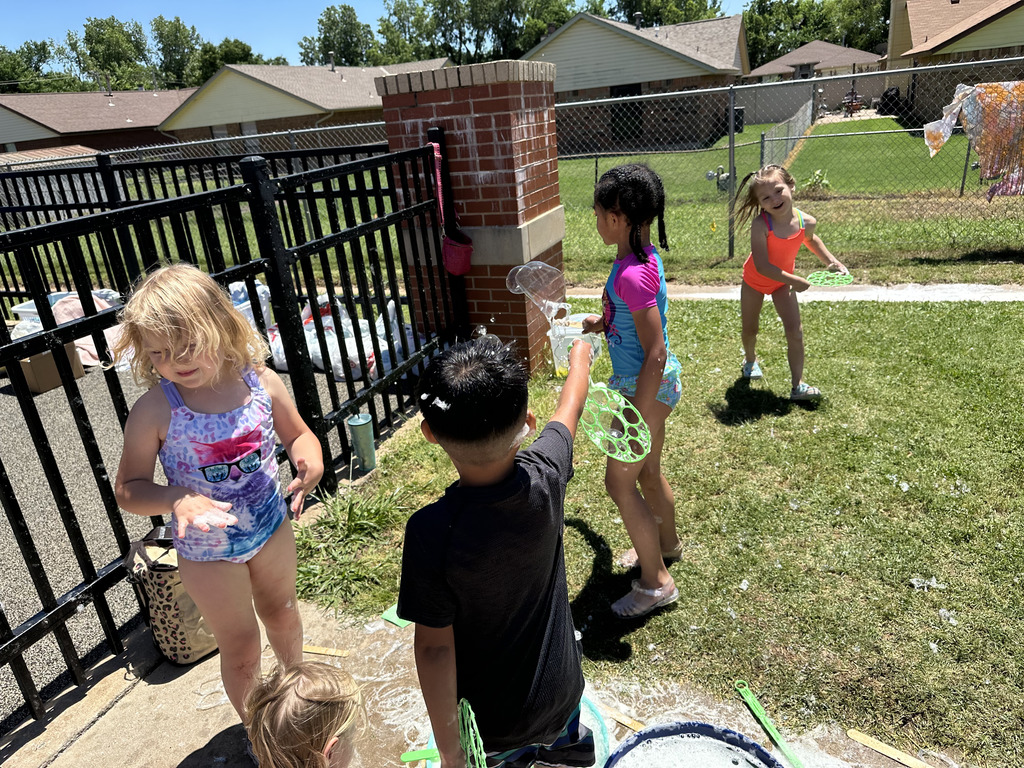 Students blowing bubbles