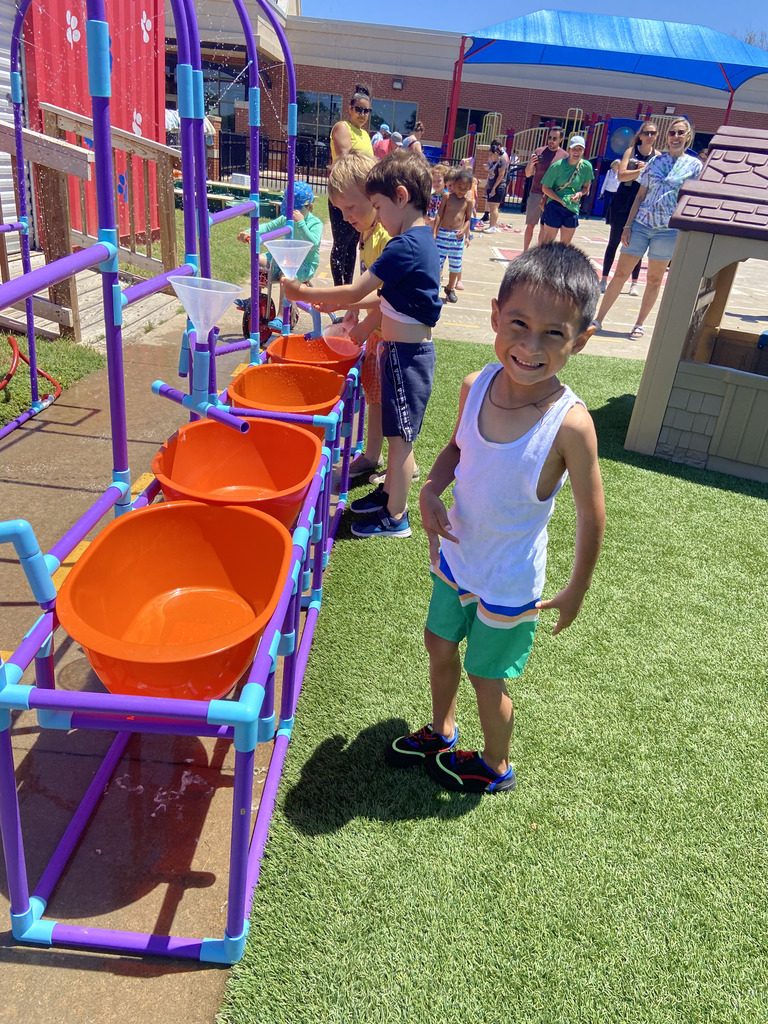 Students playing in tubs of water