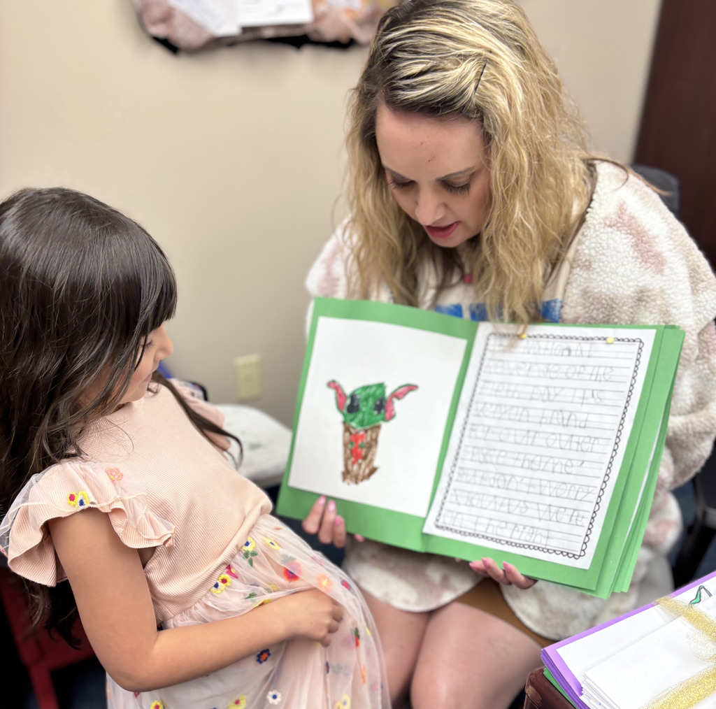 kinder student with mrs willams and her cards 